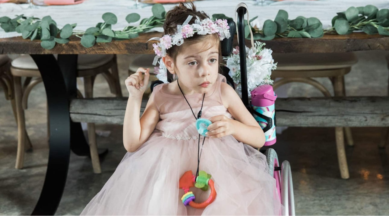 Young girl dressed up for bridal party.